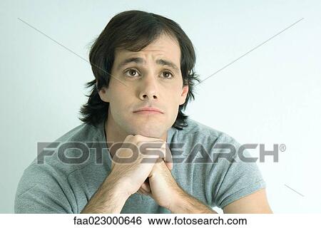 Man raising eyebrows, looking up, portrait View Large Photo Image Stock Photograph - Man raising eyebrows, looking up, portrait. Fotosearch