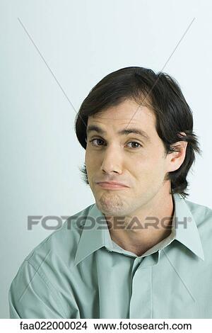 Man raising eyebrows, wrinkling chin, portrait View Large Photo Image Picture - Man raising eyebrows, wrinkling chin, portrait. Fotosearch