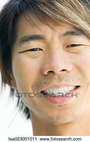 Man smiling at camera, cropped portrait View Large Photo Image Stock Image - Man smiling at camera, cropped portrait. Fotosearch