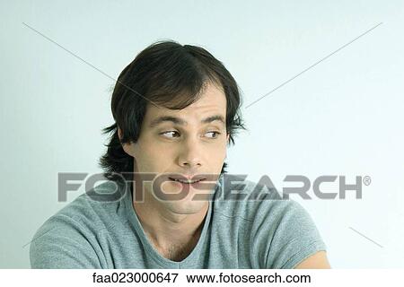 Man smiling, looking to the side, portrait View Large Photo Image Stock Photo - Man smiling, looking to the side, portrait. Fotosearch