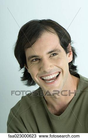 Stock Image - Man smiling, portrait. Fotosearch