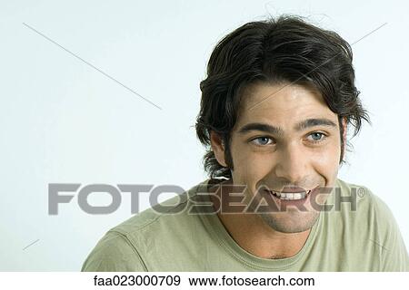 Man smiling, raising eyebrows, looking away View Large Photo Image Stock Photo - Man smiling, raising eyebrows, looking away. Fotosearch