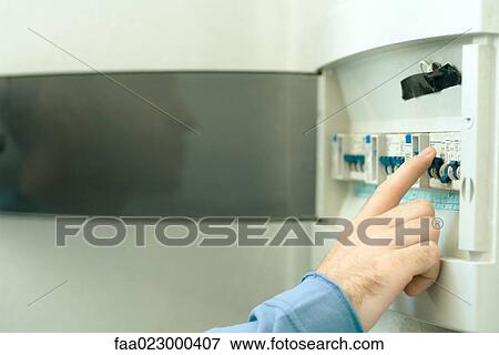 Man switching fuse in fuse box, close-up of hand View Large Photo Image Stock Photo - Man switching fuse in fuse box, close-up of hand. Fotosearch
