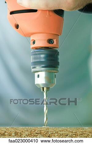 Man using drill, close-up View Large Photo Image Stock Image - Man using drill, close-up. Fotosearch