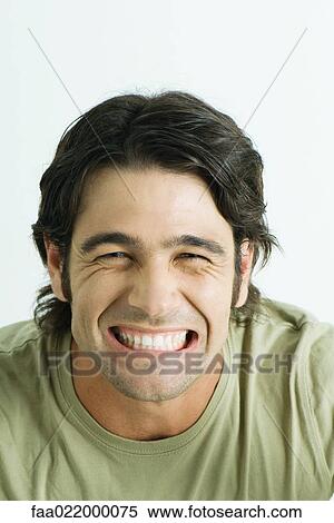 Man wincing, portrait View Large Photo Image Stock Photography - Man wincing, portrait. Fotosearch