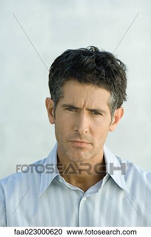 Mature man furrowing brow, looking at camera, portrait View Large Photo Image Stock Image - Mature man furrowing brow, looking at camera, portrait. Fotosearch