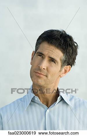 Mature man, looking up, portrait View Large Photo Image Stock Photo - Mature man, looking up, portrait. Fotosearch