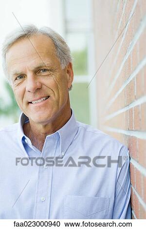 Mature man smiling at camera, portrait View Large Photo Image Stock Image - Mature man smiling at camera, portrait. Fotosearch