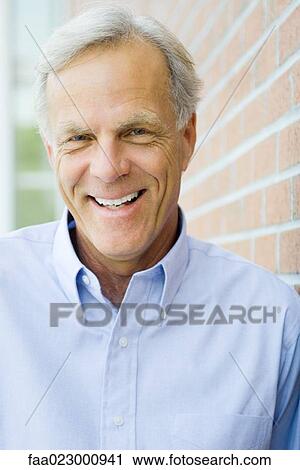 Mature man smiling at camera, portrait View Large Photo Image Stock Image - Mature man smiling at camera, portrait. Fotosearch