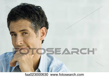 Mature man smirking at camera, portrait View Large Photo Image Stock Image - Mature man smirking at camera, portrait. Fotosearch
