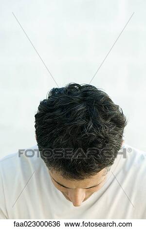 Stock Photograph - Mature man with head down, close-up. Fotosearch