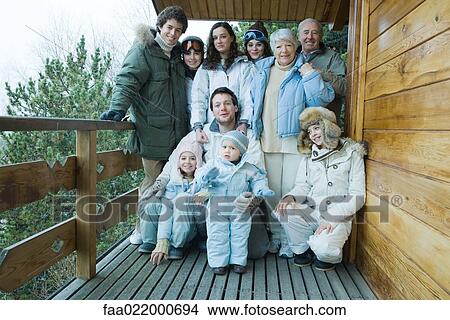 Mixed age group standing on deck in winter clothes, group portrait, full length View Large Photo Image Picture - Mixed age group standing on deck in winter clothes, group portrait, full length. Fotosearch