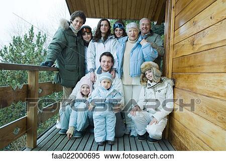 Mixed age group standing on deck in winter clothes, group portrait, full length View Large Photo Image Stock Photography - Mixed age group standing on deck in winter clothes, group portrait, full length. Fotosearch