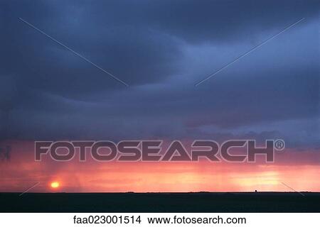 Picture - Moody sky at sunset. Fotosearch