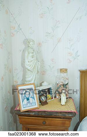 Night stand covered with religious objects and photos View Large Photo Image Stock Photo - Night stand covered with religious objects and photos. Fotosearch