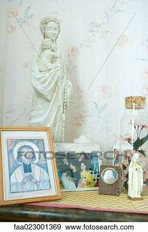 Night stand covered with religious objects and photos View Large Photo Image Stock Photo - Night stand covered with religious objects and photos. Fotosearch