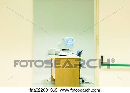 Office with desktop computer, view through doorway View Large Photo Image Stock Image - Office with desktop computer, view through doorway. Fotosearch