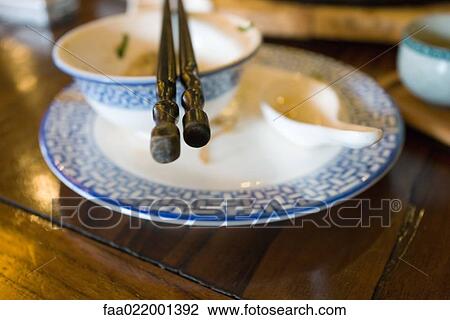 Plate with bowl, soup spoon and chopsticks View Large Photo Image Stock Image - Plate with bowl, soup spoon and chopsticks. Fotosearch