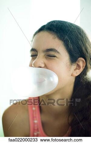 Preteen girl blowing bubble with chewing gum View Large Photo Image Stock Image - Preteen girl blowing bubble with chewing gum. Fotosearch