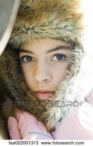 Preteen girl, wearing fur hat, holding flaps together over neck, close-up portrait View Large Photo Image Stock Image - Preteen girl, wearing fur hat, holding flaps together over neck, close-up portrait. Fotosearch