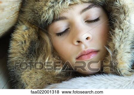 Preteen girl, wearing fur hat, wrapped in fur blanket, sleeping, close-up portrait View Large Photo Image Stock Photo - Preteen girl, wearing fur hat, wrapped in fur blanket, sleeping, close-up portrait. Fotosearch