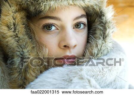 Preteen girl, wearing fur hat, wrapped in fur blanket, looking at camera, close-up portrait View Large Photo Image Stock Photography - Preteen girl, wearing fur hat, wrapped in fur blanket, looking at camera, close-up portrait. Fotosearch