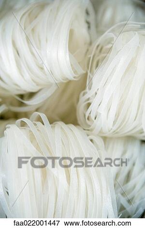 Rice noodles, full frame View Large Photo Image Stock Photo - Rice noodles, full frame. Fotosearch