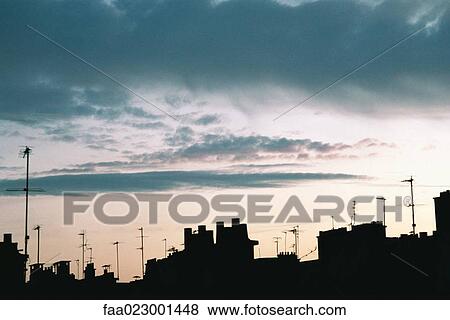 Roofline silhouetted against sky at twilight View Large Photo Image Stock Photo - Roofline silhouetted against sky at twilight. Fotosearch