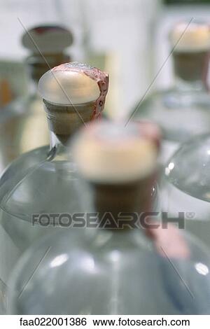 Stock Photograph - Sealed bottles, high section. Fotosearch