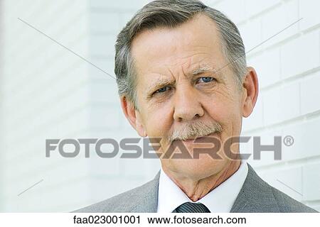 Senior businessman smiling at camera, portrait View Large Photo Image Stock Image - Senior businessman smiling at camera, portrait. Fotosearch