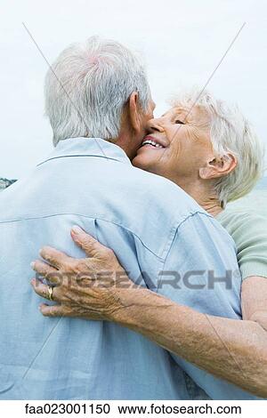 Senior couple hugging, close-up View Large Photo Image Stock Image - Senior couple hugging, close-up. Fotosearch