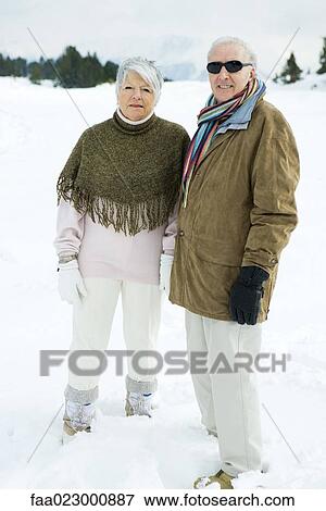 Senior couple standing side by side outdoors, looking at camera, portrait View Large Photo Image Stock Photo - Senior couple standing side by side outdoors, looking at camera, portrait. Fotosearch