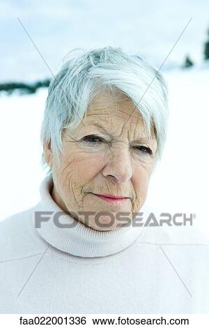 Senior woman in snowy landscape, portrait View Large Photo Image Stock Photograph - Senior woman in snowy landscape, portrait. Fotosearch