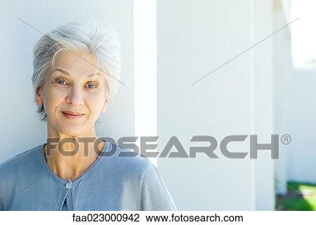 Senior woman smiling at camera, portrait View Large Photo Image Stock Image - Senior woman smiling at camera, portrait. Fotosearch