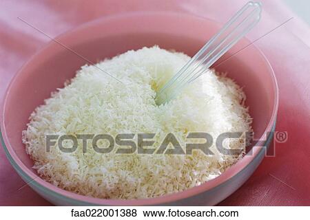 Shredded coconut in bowl View Large Photo Image Stock Photo - Shredded coconut in bowl. Fotosearch