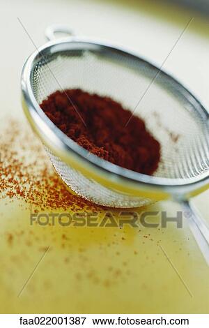 Sieve containing cocoa powder, close-up View Large Photo Image Stock Photo - Sieve containing cocoa powder, close-up. Fotosearch