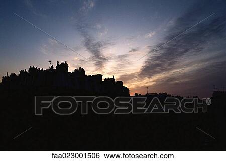 Silhouette of rooflines at twilight View Large Photo Image Stock Photograph - Silhouette of rooflines at twilight. Fotosearch