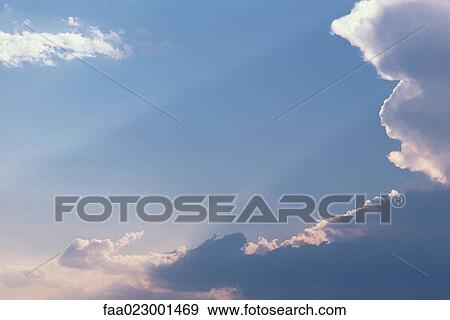 Skyscape with clouds and beams of sunlight View Large Photo Image Stock Photo - Skyscape with clouds and beams of sunlight. Fotosearch