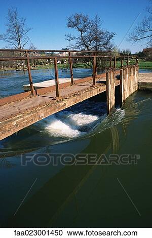 Sluice in rural landscape View Large Photo Image Stock Image - Sluice in rural landscape. Fotosearch