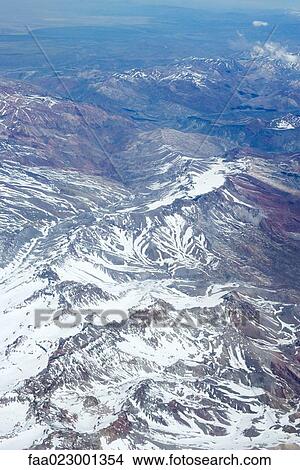 Picture - Snow-covered mountain range, aerial view. Fotosearch
