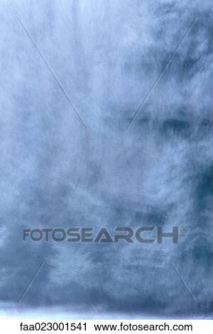 Stock Image - Snow-covered trees, defocused. Fotosearch