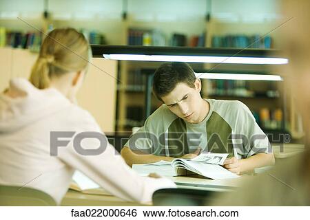 Students studying in library View Large Photo Image Stock Photograph - Students studying in library. Fotosearch