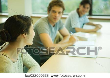 Students studying in university library, chatting with each other View Large Photo Image Stock Image - Students studying in university library, chatting with each other. Fotosearch