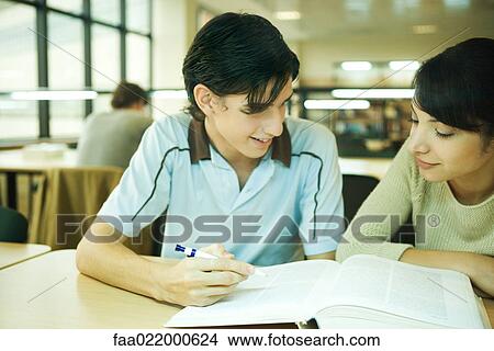 Students studying together in university library View Large Photo Image Picture - Students studying together in university library. Fotosearch