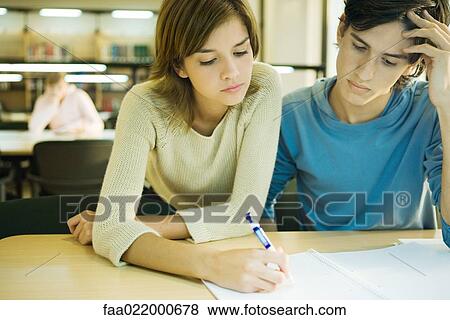 Students studying together in university library View Large Photo Image Stock Photo - Students studying together in university library . Fotosearch