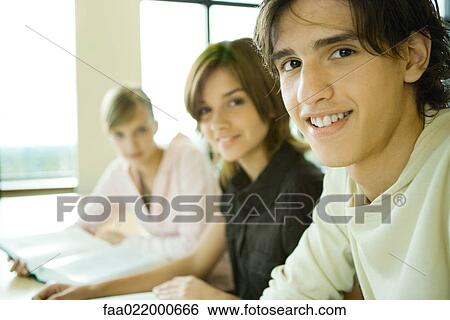 Students studying together, looking at camera, portrait View Large Photo Image Stock Photograph - Students studying together, looking at camera, portrait. Fotosearch