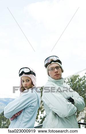 Teen girl and older brother standing back to back, arms folded, young man looking at camera View Large Photo Image Stock Photo - Teen girl and older brother standing back to back, arms folded, young man looking at camera. Fotosearch