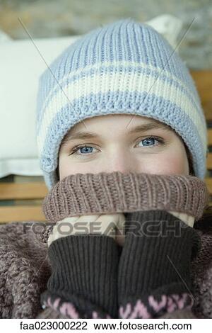 Teen girl covering mouth with turtle neck sweater, portrait View Large Photo Image Stock Image - Teen girl covering mouth with turtle neck sweater, portrait. Fotosearch