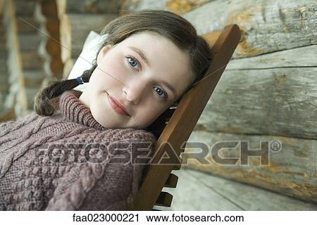 Teen girl leaning back in chair, portrait View Large Photo Image Stock Image - Teen girl leaning back in chair, portrait. Fotosearch