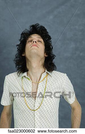 Teenage boy tossing hair, head back, portrait View Large Photo Image Stock Image - Teenage boy tossing hair, head back, portrait. Fotosearch